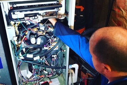 Home Comfort technician making repairs