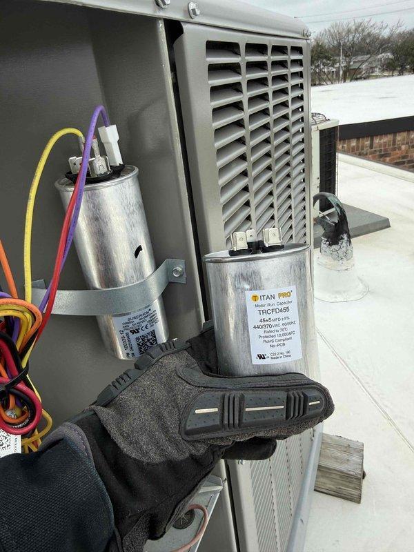 Completed spring preventive maintenance on commercial rooftop HVAC unit. Performed comprehensive system inspection including electrical diagnostics with amp draw readings showing 44.8 amps on compressor circuit. Replaced failed dual run capacitor with new Titan Pro unit and verified proper electrical connections. Inspected condenser coil, verified all wire terminations secure, and documented updated equipment specifications and filter information for maintenance records per contract requirements.