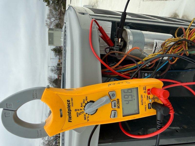 Completed spring preventive maintenance on commercial HVAC system per contract agreement. Performed comprehensive inspection of outdoor condensing unit, verifying electrical connections, control board operation, and measuring operating amperage at 9.3 amps. Documented equipment specifications and filter requirements, photographing control panel wiring and electrical components for service records.