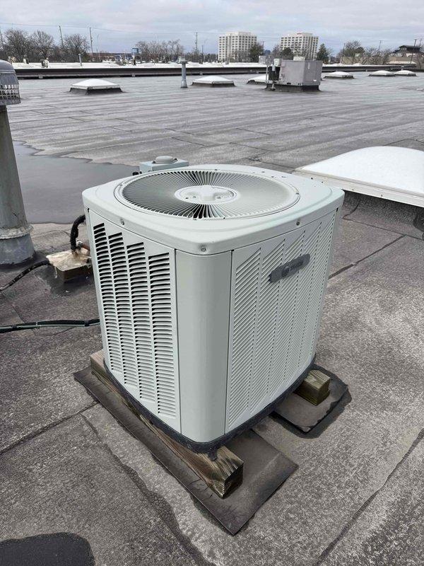 Completed spring preventive maintenance inspection on rooftop air conditioning unit. Performed comprehensive checklist evaluation, documented electrical compartment components including capacitor and contactor assembly, updated equipment specifications and filter information for maintenance records. Photographed unit condition and flagged necessary updates to filter inventory list.