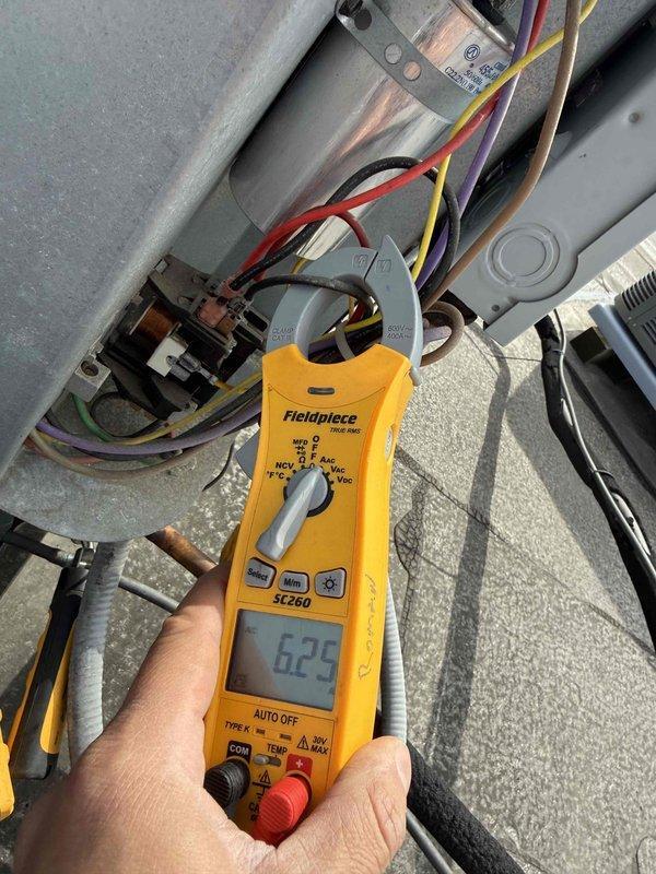 Completed spring preventive maintenance on commercial HVAC unit per contract specifications. Performed comprehensive inspection of electrical components including capacitor and contactor, verified proper voltage and amperage readings using clamp meter with all measurements within acceptable parameters. Updated equipment information and filter specifications, documented system conditions with photos, and completed required maintenance checklist with all components operating normally.