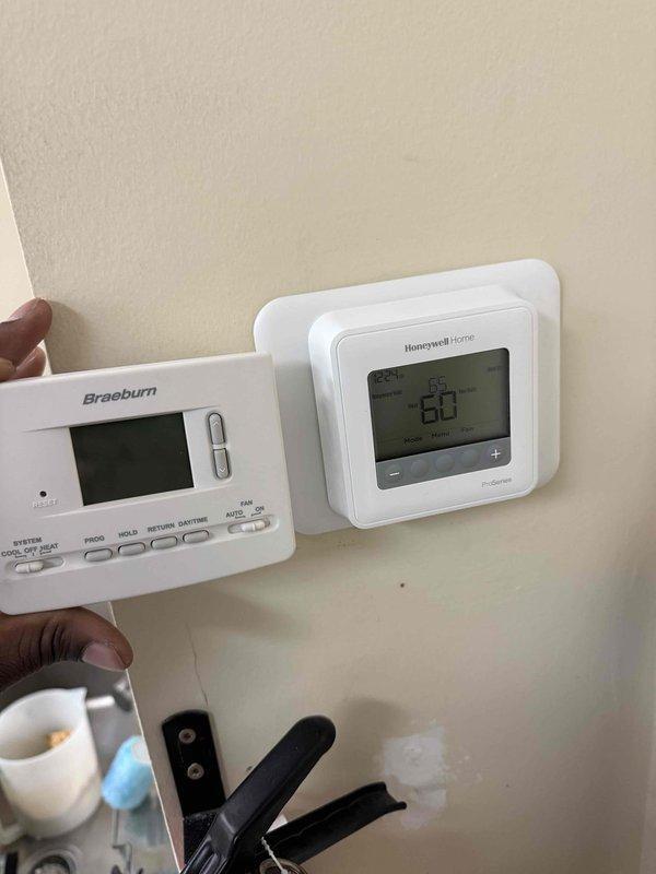 Arlington Heights, IL - Performed commercial preventive maintenance visit under prepaid service agreement. Removed existing Honeywell Home thermostat and installed new Braeburn digital programmable thermostat on wall-mounted location. Verified proper wiring connections, tested system operation, and confirmed temperature control functionality. Unit responding correctly to thermostat commands with accurate temperature display reading.