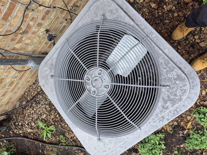 Completed Comfort Plan preventive maintenance on 10-year-old outdoor air conditioning system. Performed comprehensive clean and check including inspection of condenser unit, fan assembly, and protective grille; verified thermostat operation and temperature settings; cleaned exterior housing and removed debris from unit perimeter. All components found operating within normal parameters with no immediate service needs identified.
