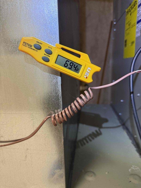 Performed comprehensive clean and check maintenance on mini-split air conditioning system per comfort plan agreement. Conducted diagnostic testing using digital thermometer measuring supply air temperature at 59.4°F and clamp meter recording electrical readings of 112.2 volts and 0.022 amps, confirming system operating within normal parameters. Completed full inspection of outdoor unit including condenser coils, electrical connections, and refrigerant lines with all components found in proper working condition.