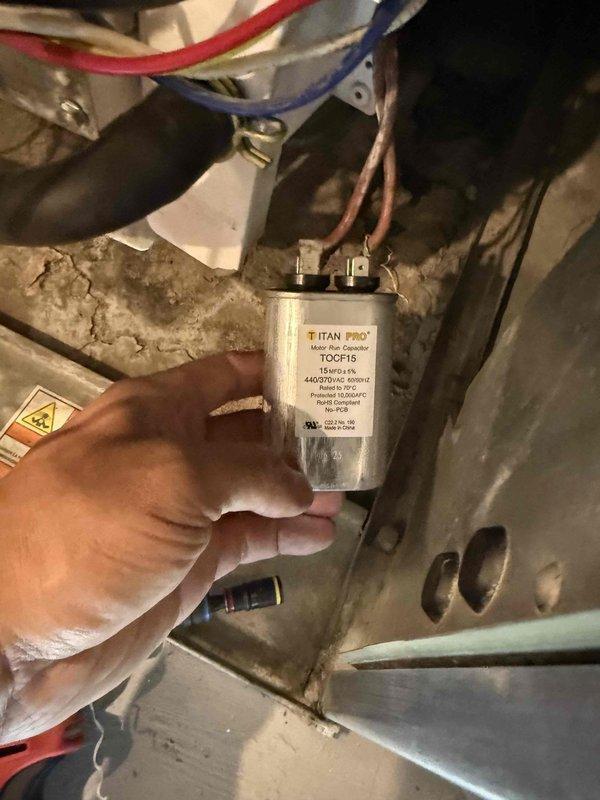 Responded to service call for HVAC system with non-operational blower fan in both heating and cooling modes. Performed diagnostic inspection and identified failed TITAN PRO capacitor (Model TOC-15, 440/370 VAC) as root cause of fan failure. Utilized thermal imaging equipment to verify temperature anomalies and confirm diagnosis before proceeding with component replacement to restore continuous fan operation.