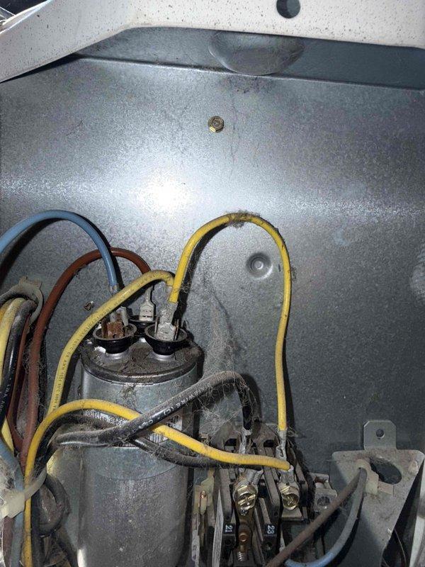 Responded to no cooling complaint on residential air conditioning system. Upon arrival, performed system diagnostics and temperature measurements. Found supply air temperature reading 58.8°F at evaporator coil. Inspected electrical components including capacitor and associated wiring connections. All equipment information documented and photographed for service records.
