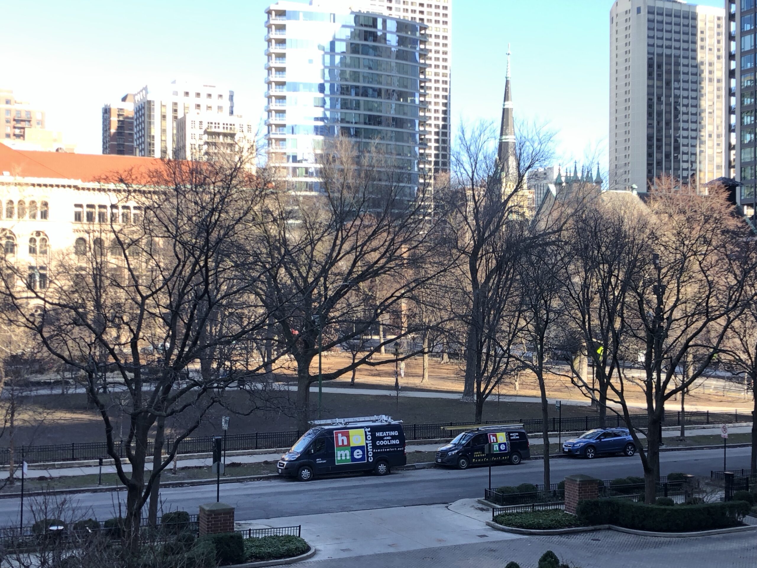 Home Comfort work vans on the road outside the new office location