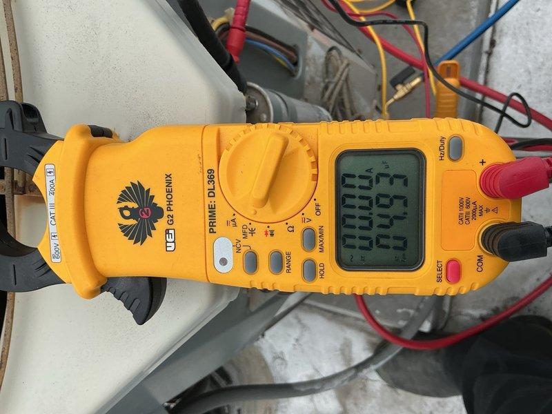 Completed Comfort Plan clean and check on single AC system per agreement terms, excluding humidifier service. Performed comprehensive electrical diagnostics using digital multimeter to verify system voltage, amperage, and phase readings across all power legs. All electrical measurements recorded within manufacturer specifications, confirming proper system operation and performance.