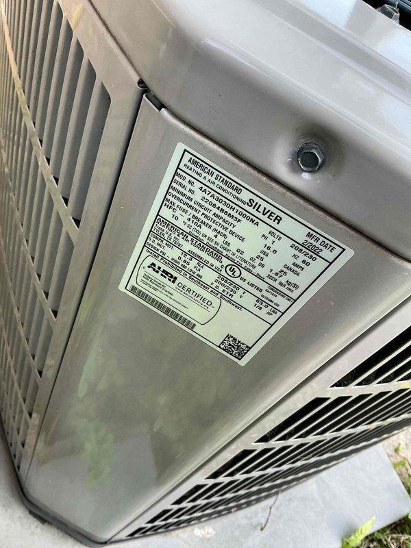 Diagnosed residential air conditioning system experiencing fluctuating head pressure, superheat, and subcooling readings indicating moisture contamination or blocked piston. Recommended complete system service including refrigerant recovery, piston and line inspection with blow-through procedure, filter drier installation, system evacuation, and recharge to manufacturer specifications. Estimated three hours for warranty repair completion on outdoor condenser unit installed on concrete pad at brick residence.