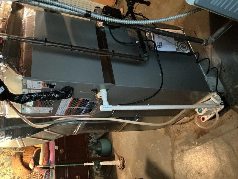 Completed full air conditioning system replacement on first floor unit. Reclaimed existing refrigerant from old condenser, evaporator coil, and line-set, then disconnected and removed all obsolete equipment. Installed new Lennox 2-ton 18 SEER2 variable speed condensing unit (Model EL18KCV-024-230) on new equipment pad and mounted matching evaporator coil in air handler. Connected new coil to existing copper refrigerant lines, evacuated system to remove moisture and air, then charged with R454B refrigerant to manufacturer specifications. Installed Lennox S40 communicating thermostat with Wi-Fi capability and touchscreen interface, configured for system communication and programmed for optimal operation. Installed refrigerant detection system (RDS) as required safety mitigation measure. Performed complete system start-up, tested all components for proper operation, verified airflow and temperature differential, and conducted comprehensive safety inspection. System operating within manufa